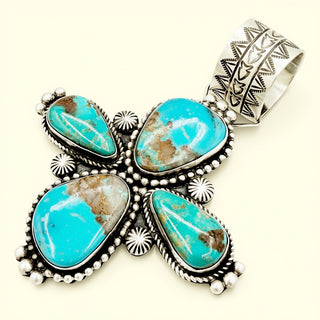 Turquoise cross pendant on a beige background