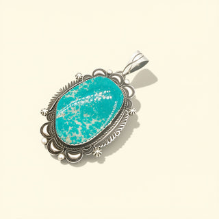 Turquoise pendant on a beige background