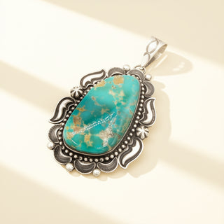Turquoise pendant on a beige background