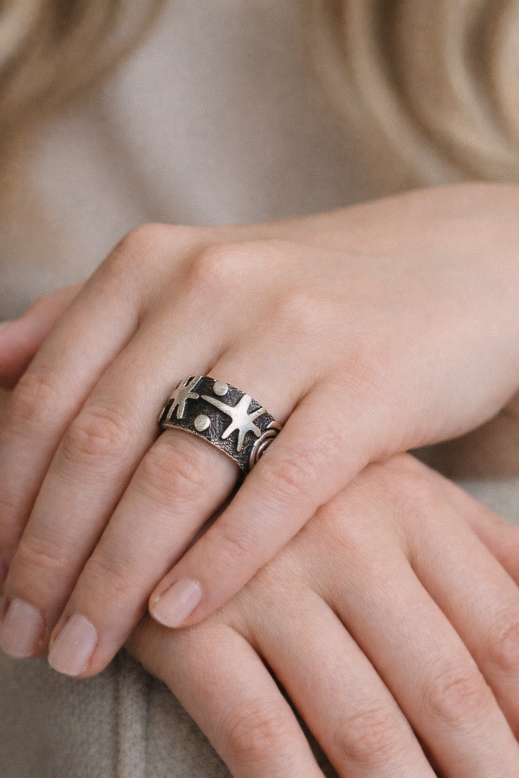 Black and silver ring on hand 