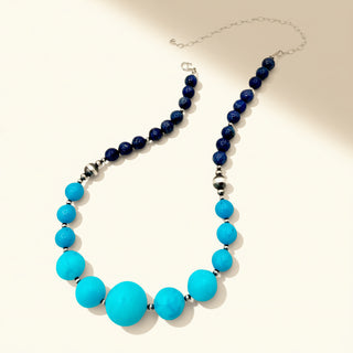Necklace with blue and turquoise beads on a white background