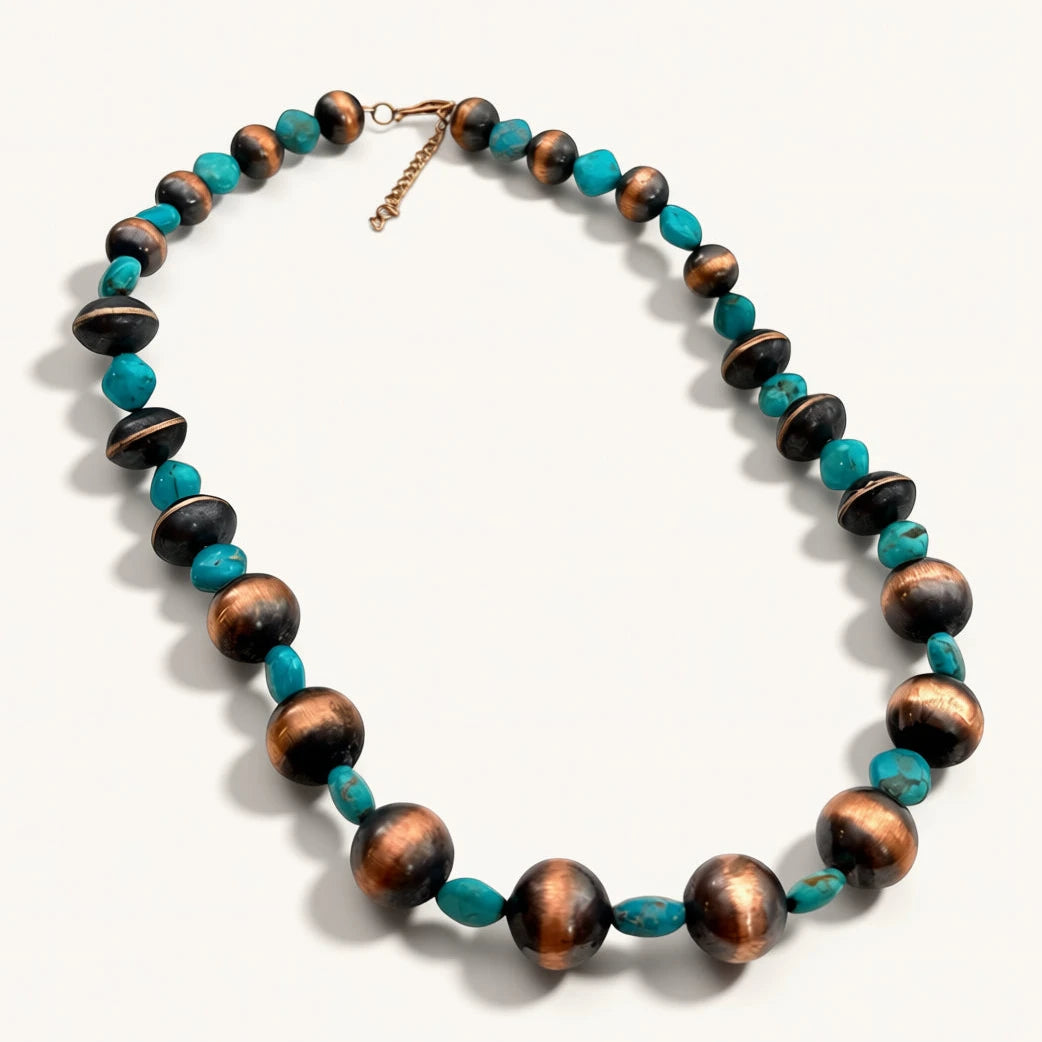 Necklace with brown and turquoise beads on a white background