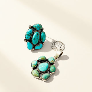 Turquoise stone jewelry on a beige background