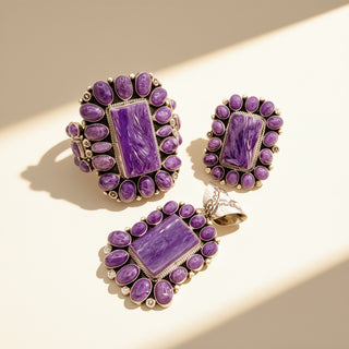 Purple gemstone jewelry set on a beige background