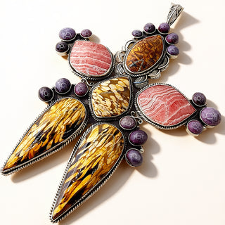 Multicolored stone pendant with silver accents on a white background