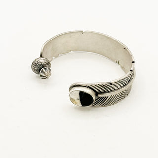 Feather Spinner Cuffs by Jason Ogg