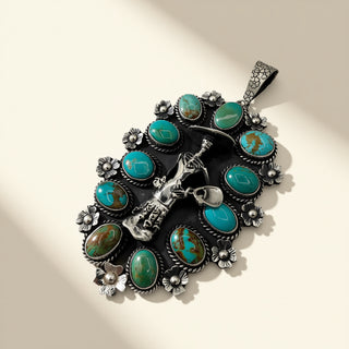 Silver and turquoise pendant on a beige background