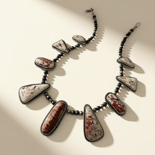 Necklace with large stone beads on a beige background