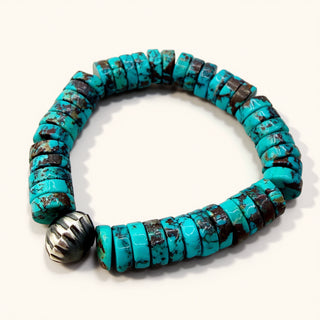 Turquoise beaded bracelet with a silver clasp on a white background