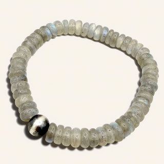 Beaded bracelet with a silver accent on a white background