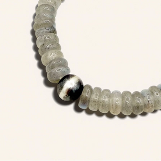 Beaded bracelet with a silver accent on a white background
