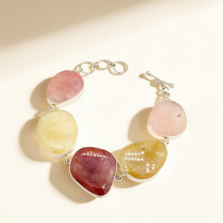 Pink bracelet with stones on a beige background