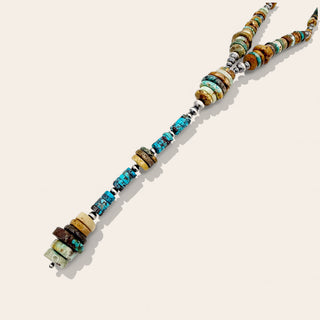 Necklace with multicolored beads on a white background