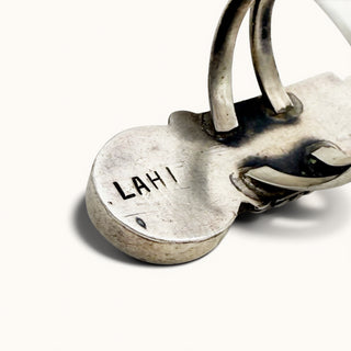Silver padlock with 'LAHI' engraving on a white background