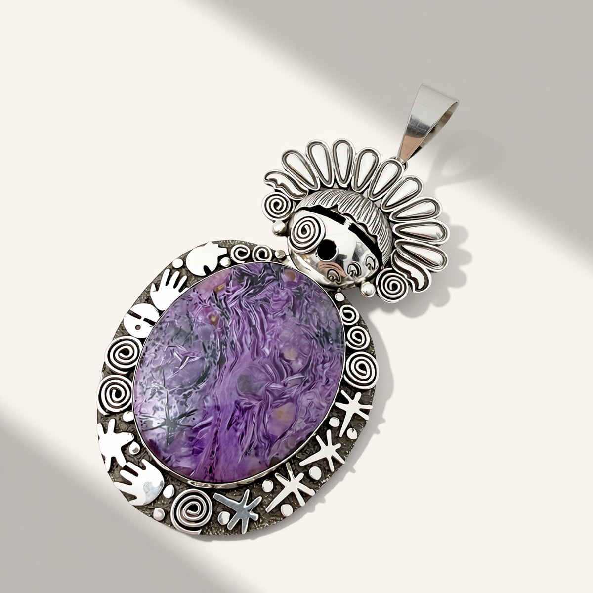 silver maiden pendant with purple stone on a beige background