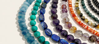 various bead strands in a variety of colors on a beige background
