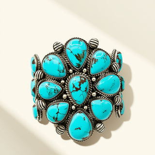Turquoise and silver bracelet on a beige background