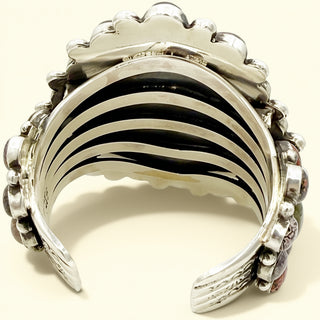 Silver cuff with black interior on a white backgroud