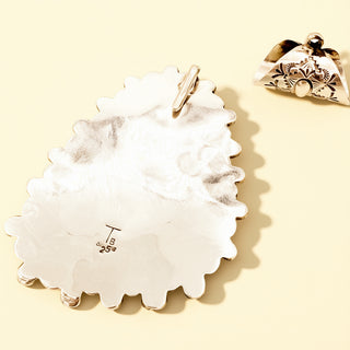 Pendant and removable bail on  light yellow background