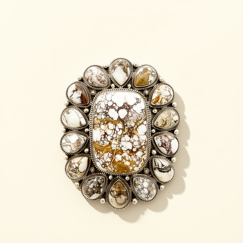 Decorative cuff with crystal-like stones on a beige background