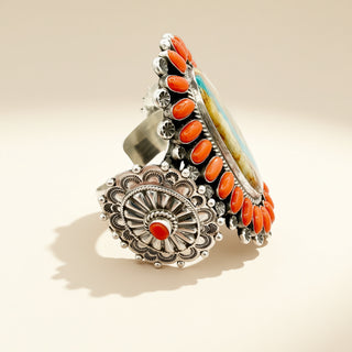 Silver and orange cuff on a beige background
