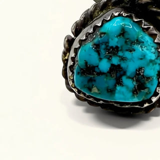 ring with turquoise stones on a white background