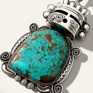 Warrior jewelry with turquoise stone on a beige background