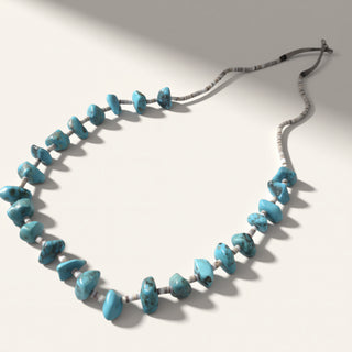 Necklace with blue beads on a white background