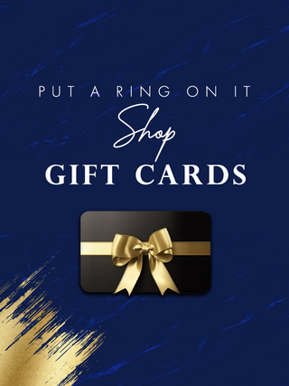 A gift card with a black background, gold ribbon, and the text 'PUT A RING ON IT Shop GIFT CARDS' on a blue textured background.