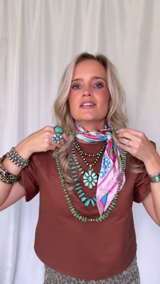 woman wearing turquoise jewelry presenting turquoise jewelry 